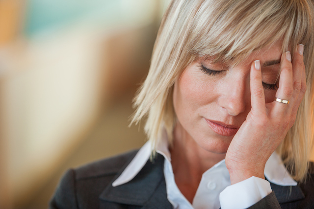 This is a picture of a woman with a migraine. Taking magnesium for migraine relief is a prudent idea and well worth a try.