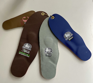This is an image of the different kinds of custom foot orthotics in Edmonton chiropractor's office Dr. Dean Collins.