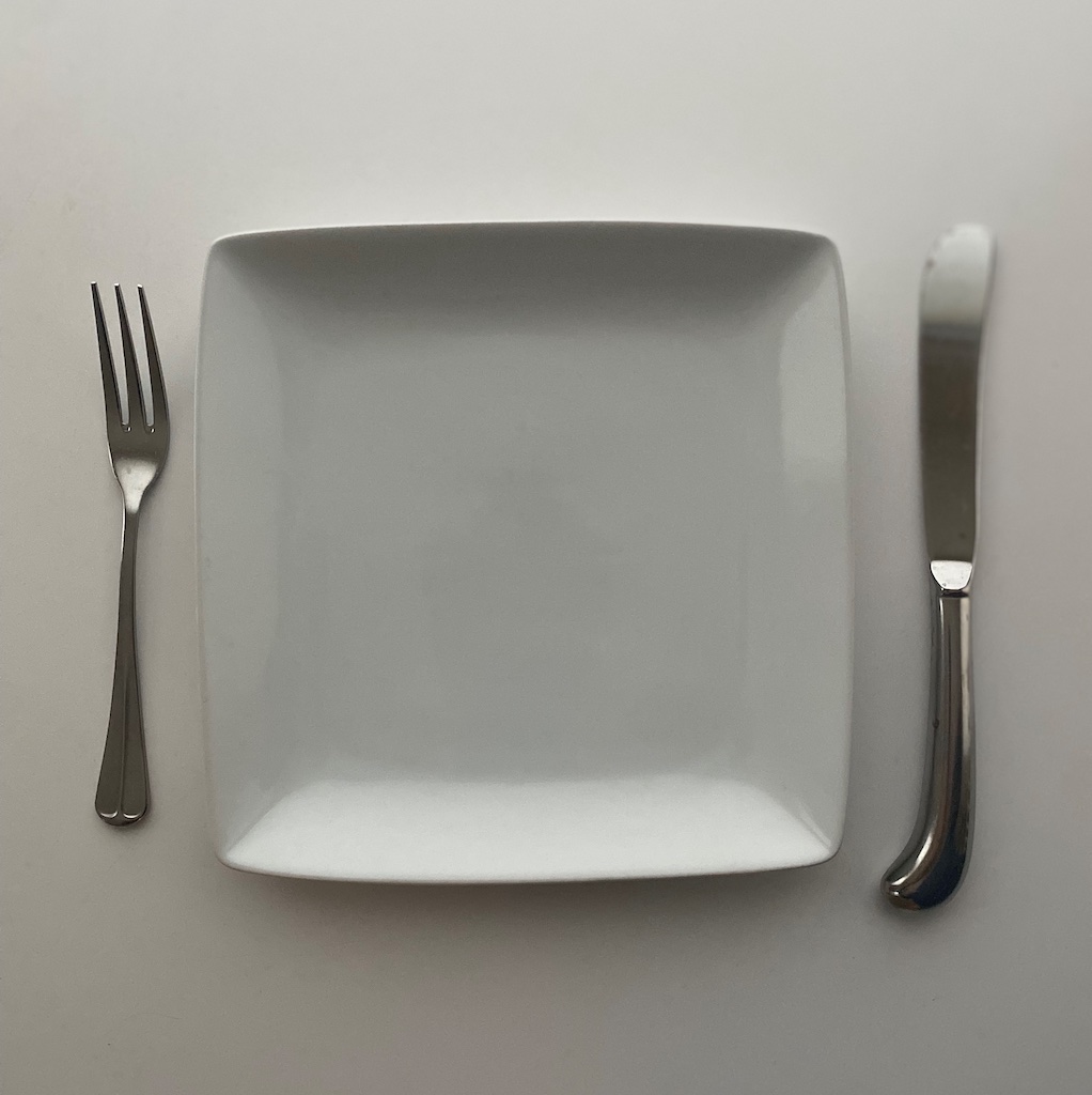 This is a picture of an empty plate to help depict how intermittent fasting for pain relief can be used.