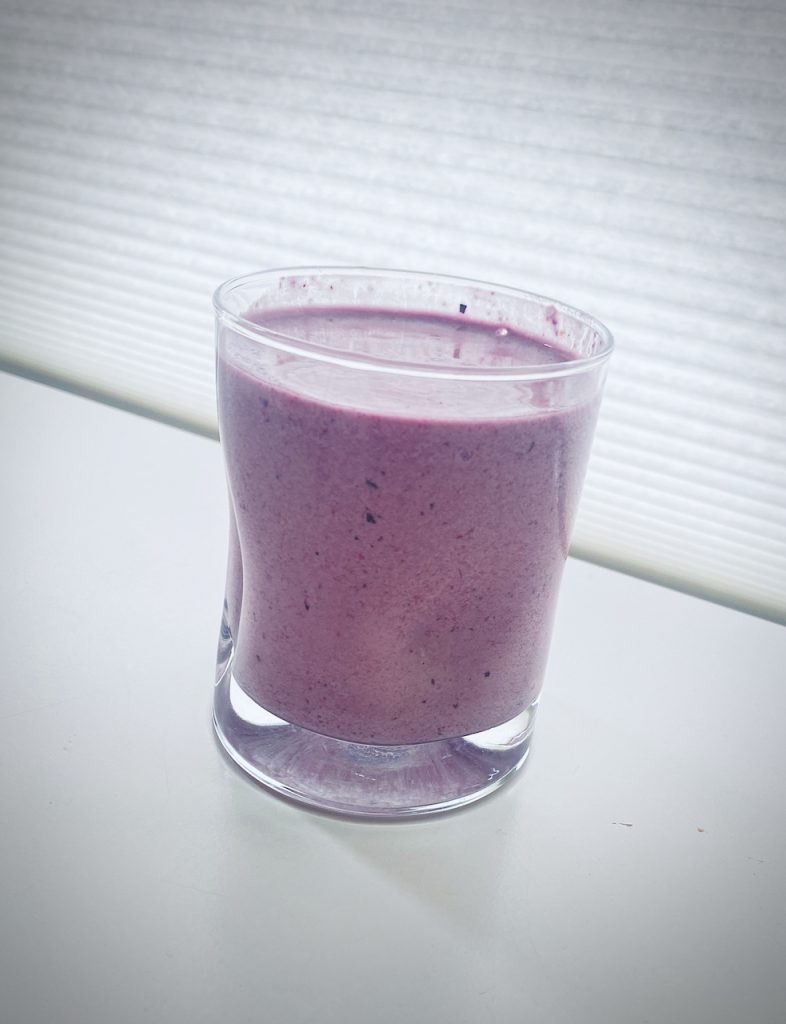This is a picture of blueberry smoothie with PurePaleo Protein powder and other ingredients to increase your daily protein needs for body repair and recovery.