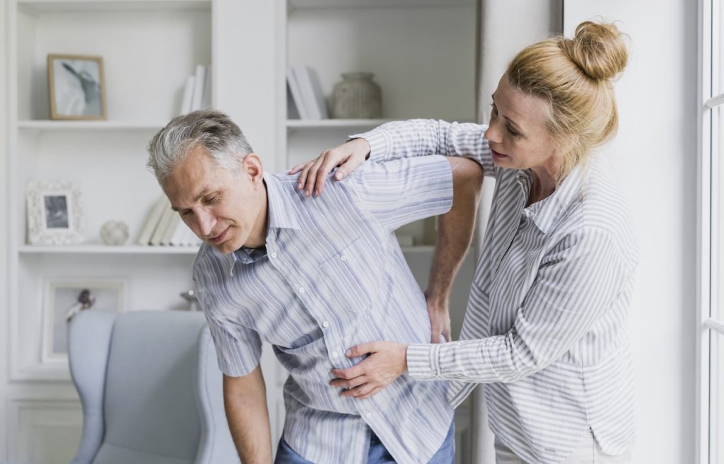 This is a picture of a man suffering from sciatica. It helps depict the information on this webpage for sciatica treatment in Edmonton.