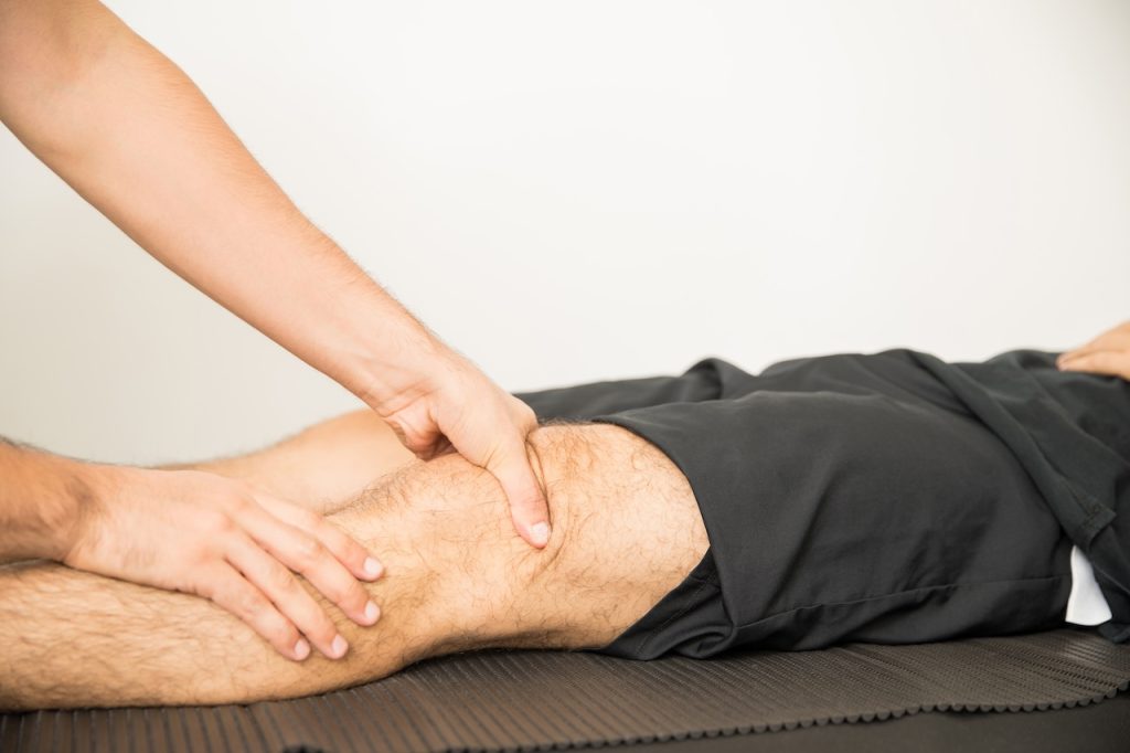 This is a picture of a person getting knee treatment in Edmonton.